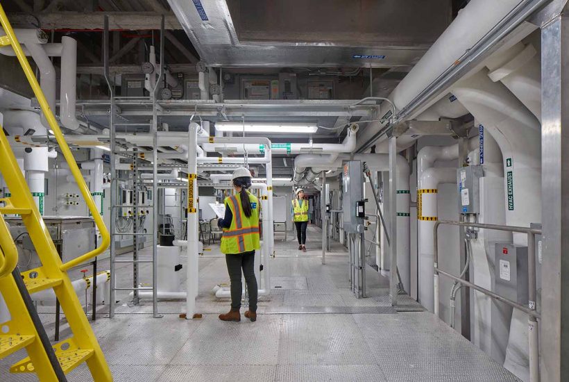 NIH DTM Germfree modular facility mezzanine People working on a modular facility mezzanine