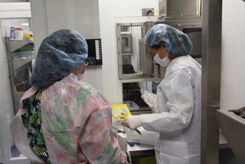 duke-raleigh-mobile-usp-797-800-pharmacy-4 Two people working inside a mobile pharmacy