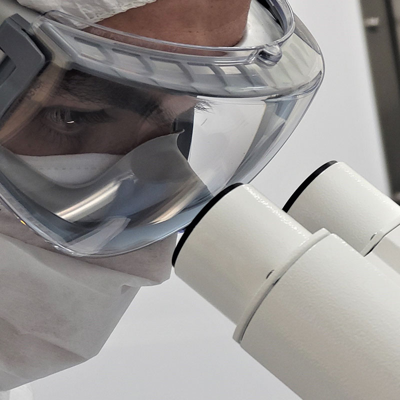 Person using a microscope